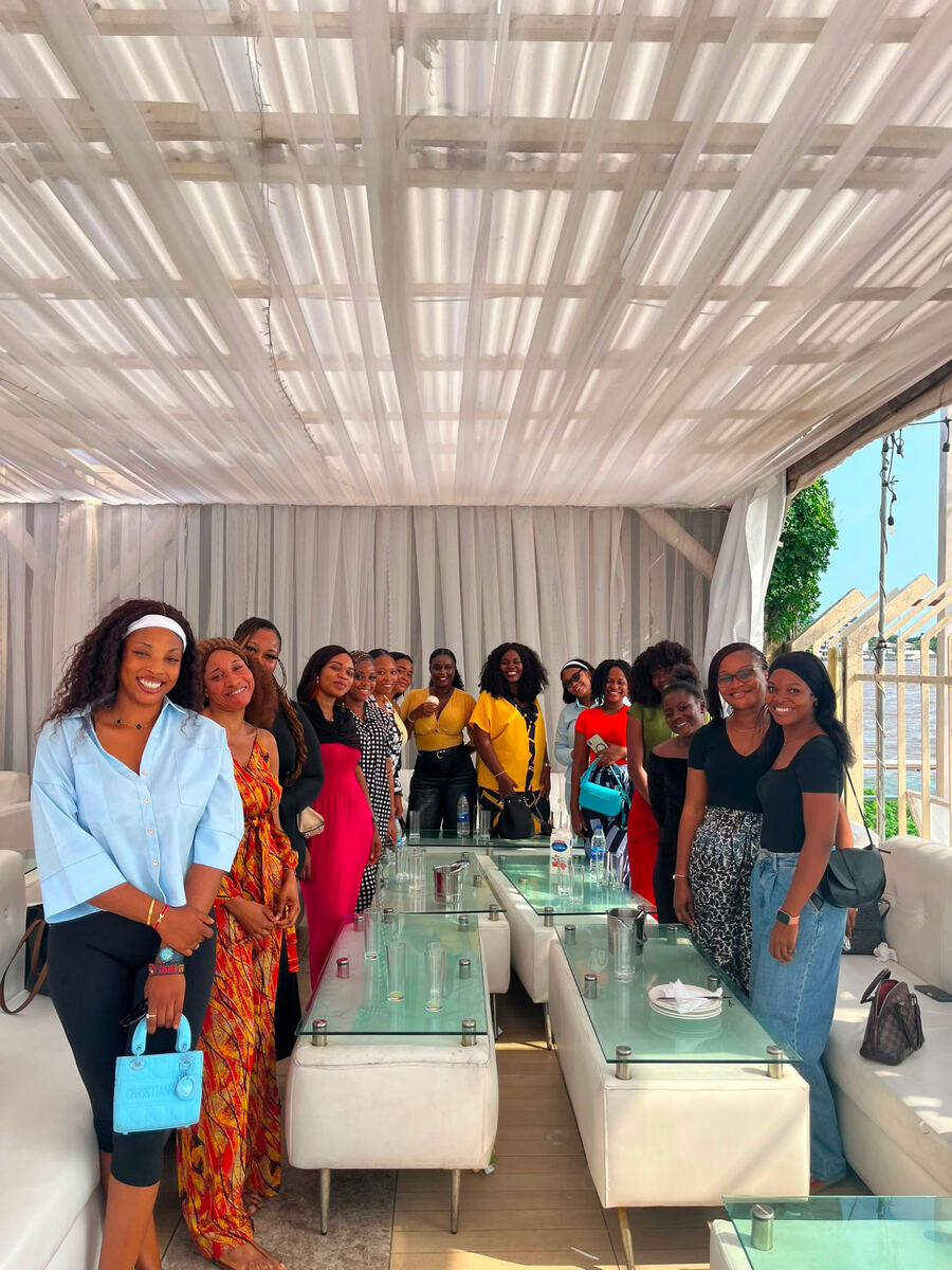 The sisterhood on the terrace, Lagos lagoon behind them