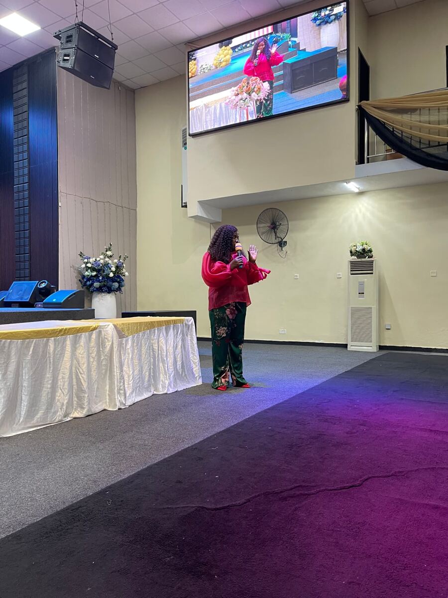 A moment from a Mrs & More gathering — Jennifer Amechi Okonkwo speaking.